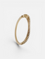 Bracelet Serti Clos bicolore porté au poignet, or 18 carats et diamants